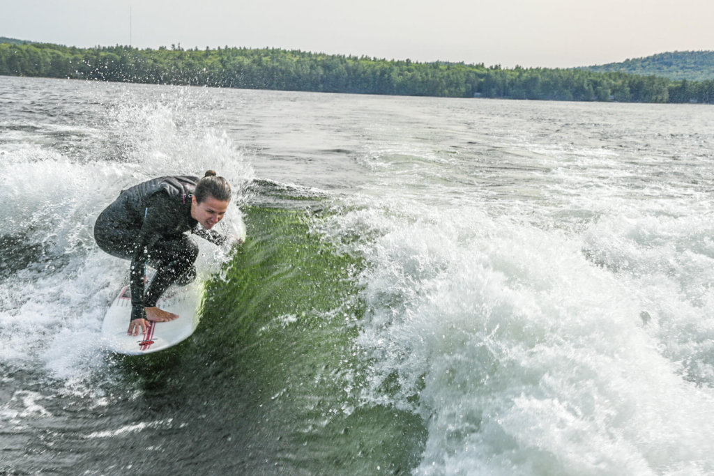 Our Store Manager Julia carves on a wake surf board.